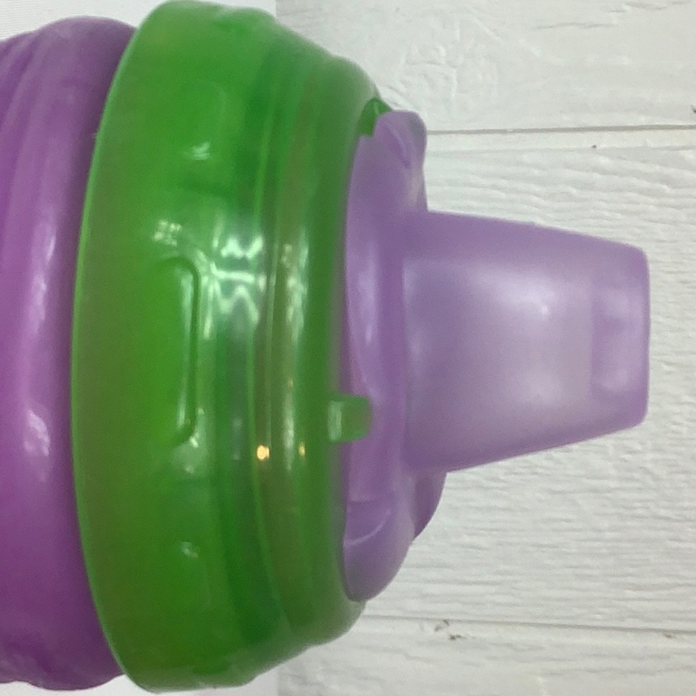 Munchkin’s green and purple sippy cup